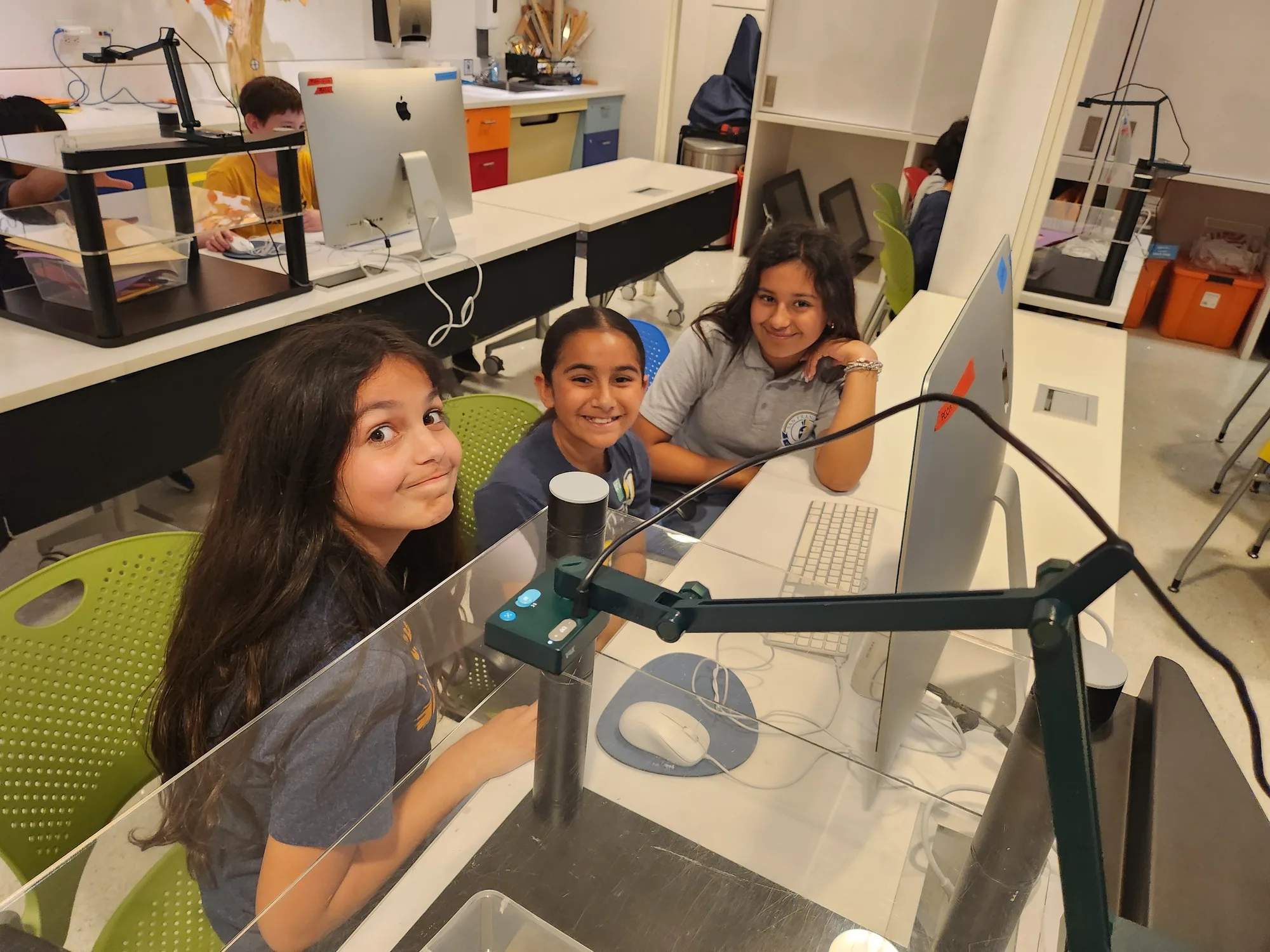 Students gathered at an interactive animation exhibit during a museum field trip