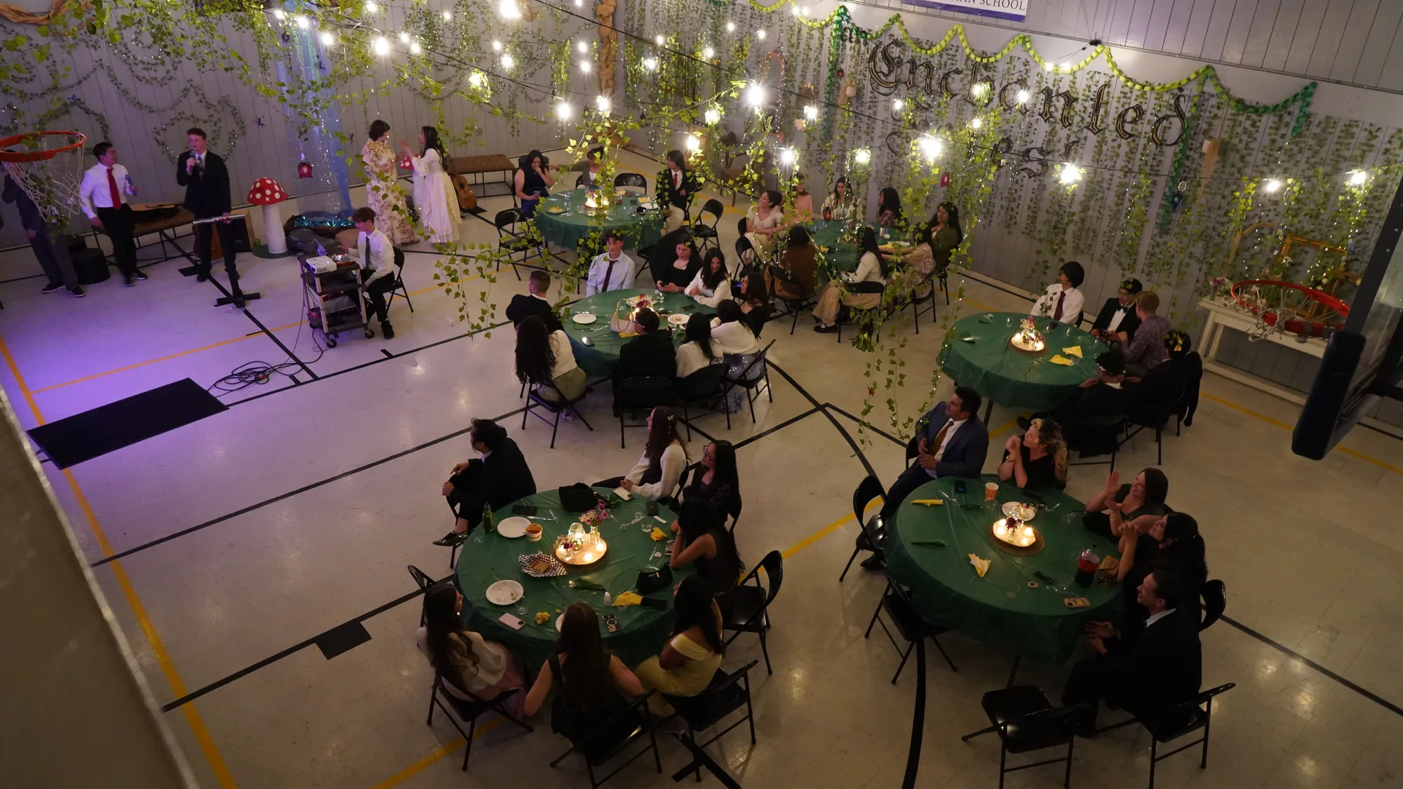 An elevated view of the banquet room with string lights and themed decor