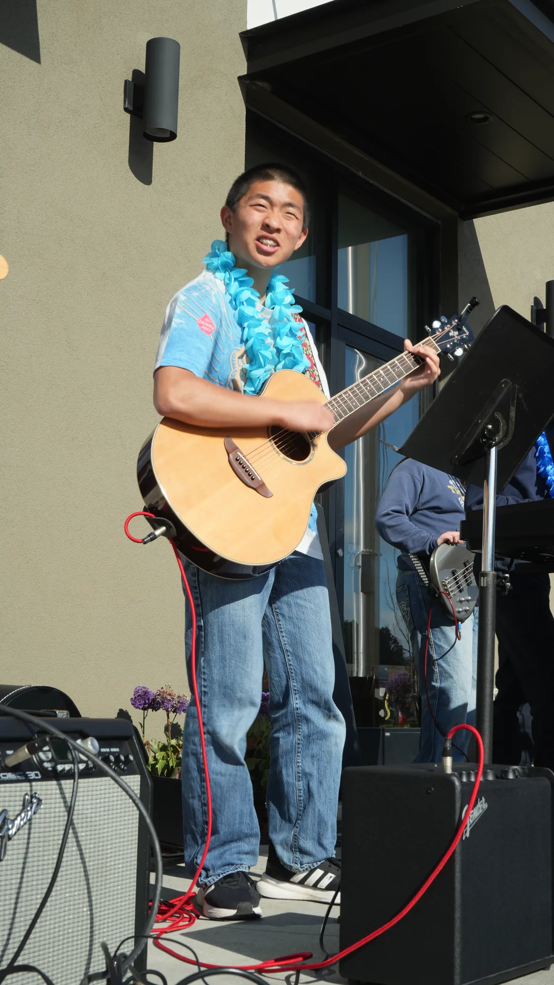 High school students performing music at a luau-themed school event